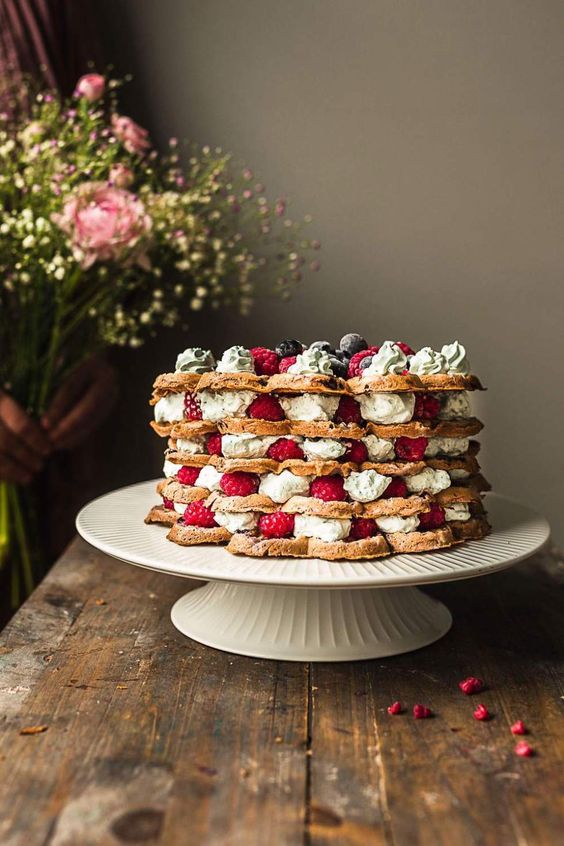 a cardamon waffle wedding cake with creamy and fresh berries is a simple dessert you can make for a wedding