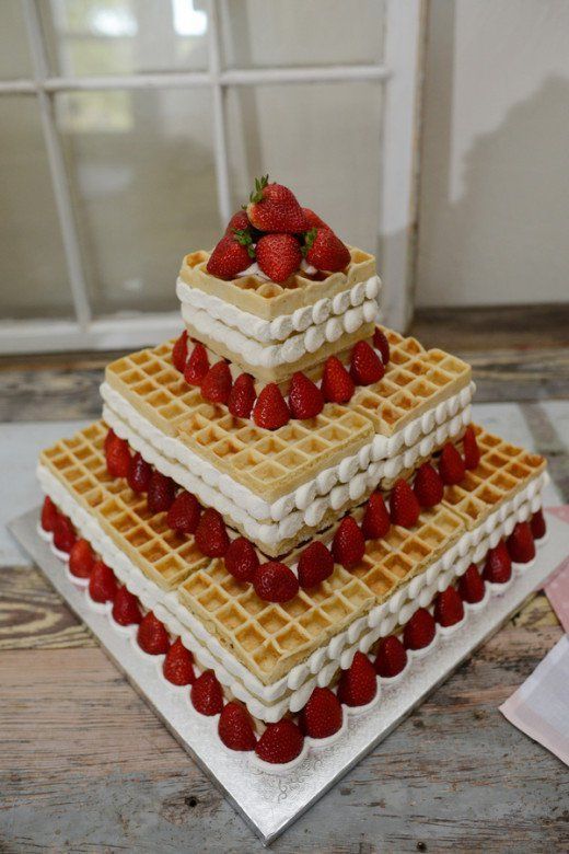 a creative square waffle wedding cake with whipped creamy and fresh strawberries is amazing for summer