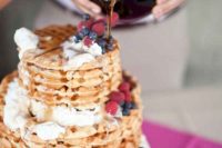 a lovely waffle wedding cake with whipped cream, honey and fresh berries is a cool idea for a brunch wedding