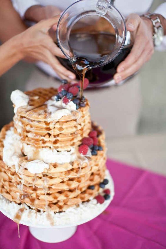 a lovely waffle wedding cake with whipped cream, honey and fresh berries is a cool idea for a brunch wedding