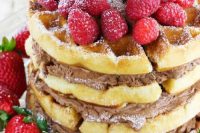 a waffle wedding cake with chocolate filling and fresh berries on top is a delicious dessert for a casual wedding