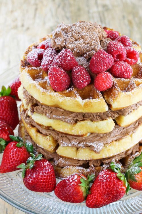 a waffle wedding cake with chocolate filling and fresh berries on top is a delicious dessert for a casual wedding