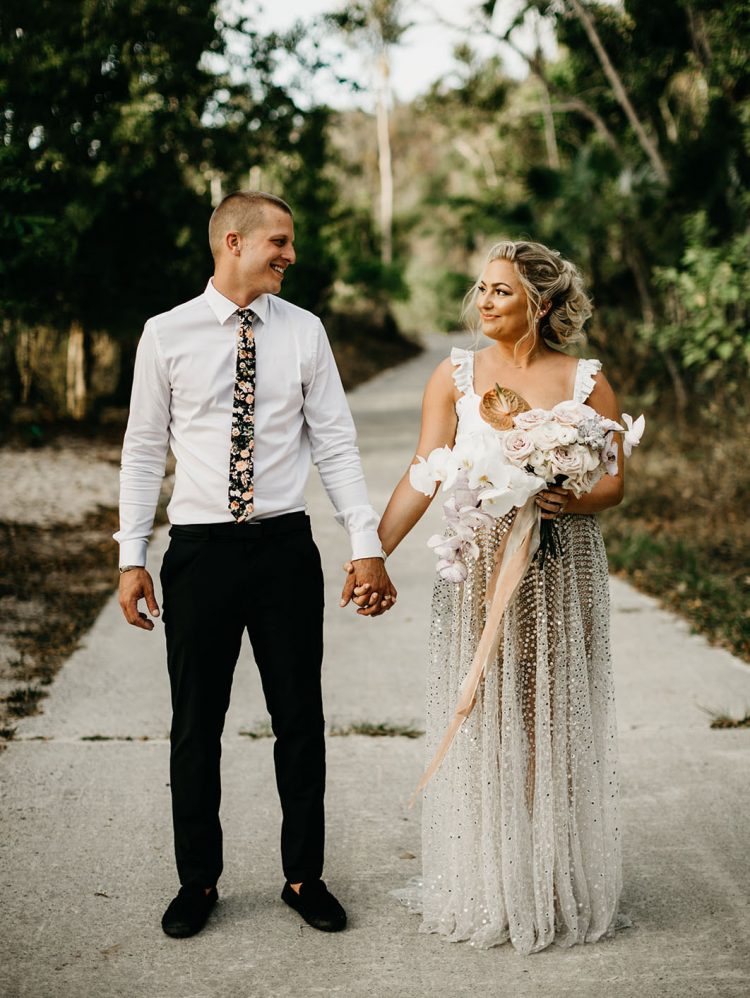 This couple went for a fun iridescent Caribbean wedding inspired by the bride's skirt