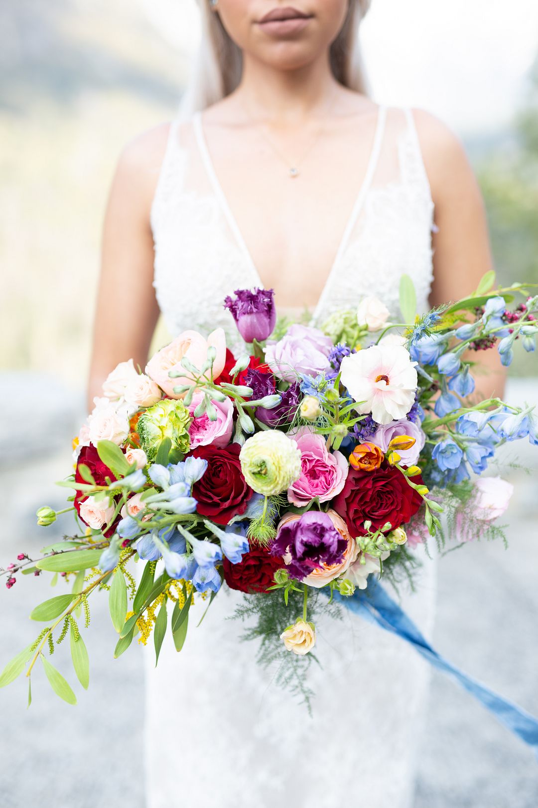 The wedding bouquet reflected the shoot theme   florals in all the different colors