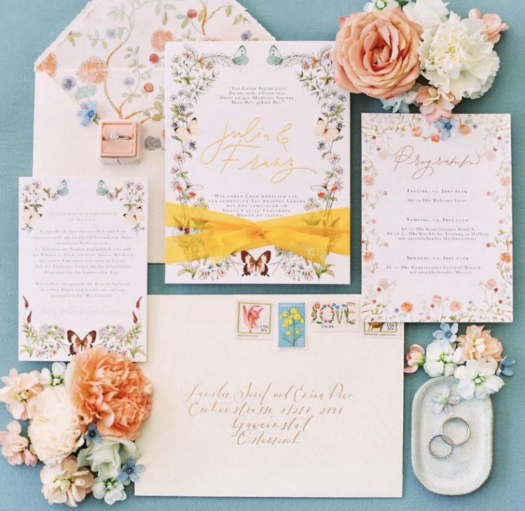 The wedding invitation was done with beautiful floral prints, bright ribbons and calligraphy