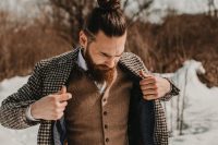 04 The groom was rocking a woolen waistcoat, plaid grey pants, a gingham coat and a bow tie plus a top knot