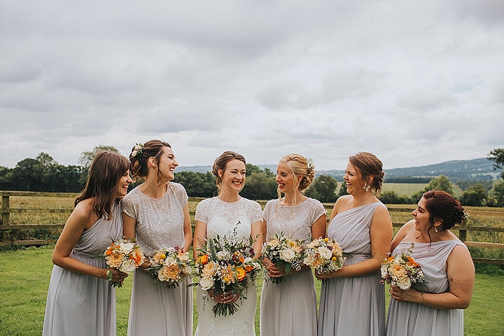 The bridesmaids were wearing silver and grey mismatching dresses and separates