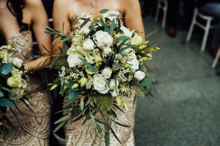 The wedding bouquets were white ones, with greenery, leaves and foliage for texture