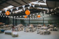 a cool barn venue decorated by bride and groom