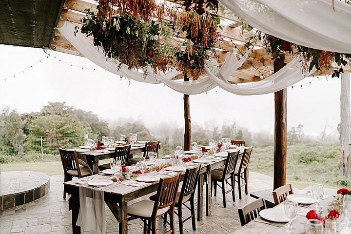 The wedding reception was done with greenery and booms overhead and on the tables