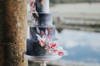 09 The wedding cake was a beautiful celestial one, with bold blooms