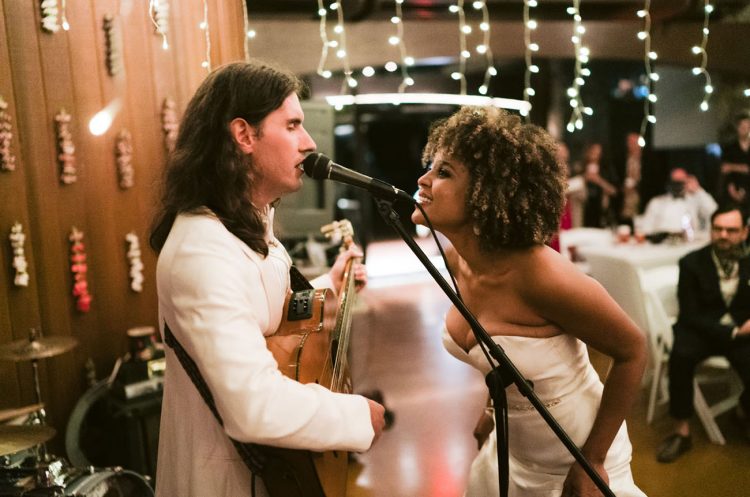 The groom wrote his own song about how they met and about their love and played it at the wedding