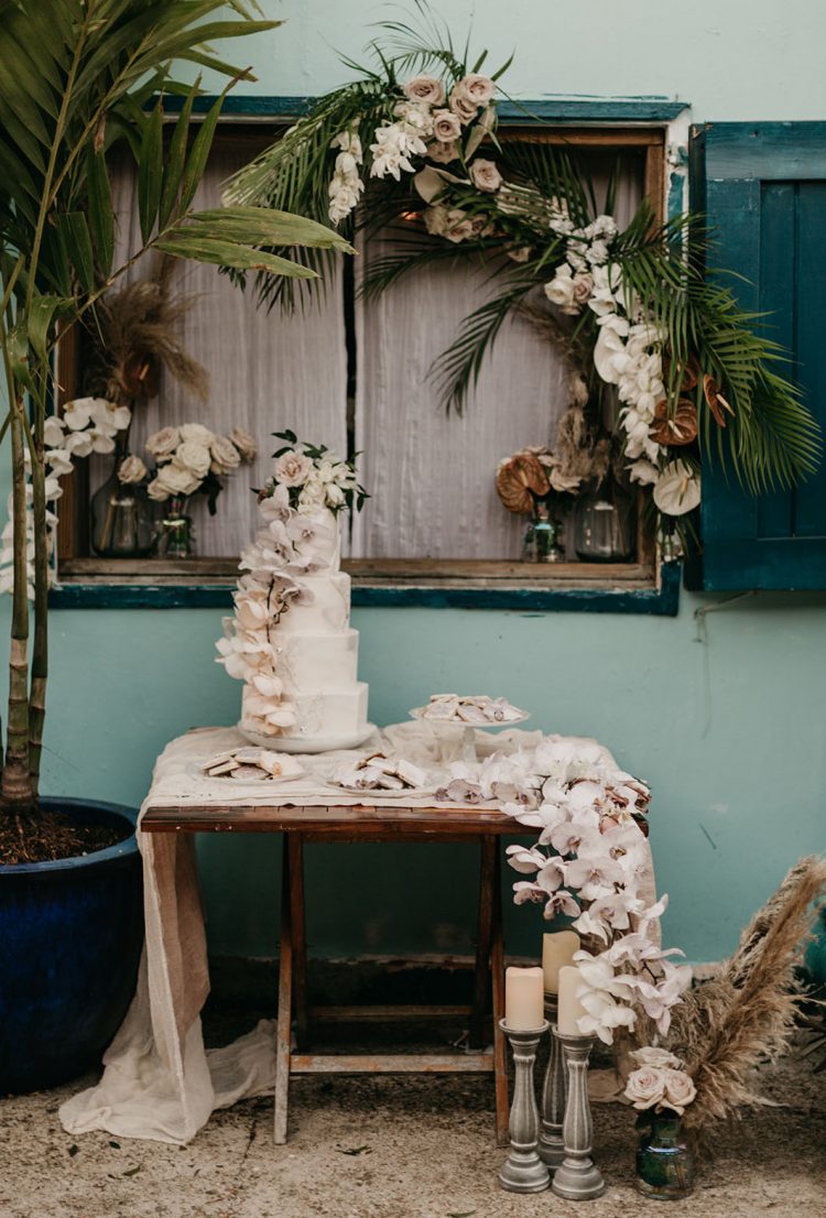 The tropical decor was amazing and romantic, with lush florals and tropical foliage