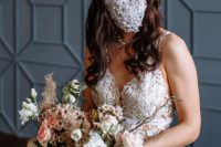 11 a ruffle and lace fully embellished and pearled face mask that highlights the bridal look and makes it fashion