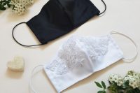 23 a black plain mask for a groom and a white lace and embellished mask for a bride are stylish and chic