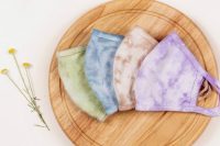 32 colorful tie dye face masks like these ones can match bridesmaids’ outfits or just add color to guests’ looks