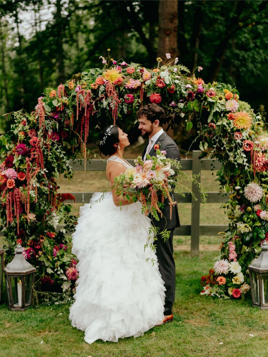This fun and bold wedding with lots of flowers and greenery took place at a ranch and was filled with blooms