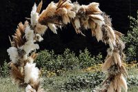 02 The wedding arch was a round one, made of pampas grass and with candle lanterns around