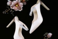 03 Her look was finished with white heeled mules with embellishments