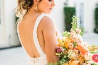 a stylish backless wedding gown