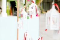 06 The wedding seating chart was done with hanging lanterns with ribbons