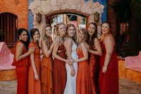 07 The bridesmaids were wearing orange, rust and red mismatching dresses and sandals