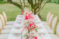 07 The wedding table setting was done with pink and blush florals, too, with pastel candles and linens