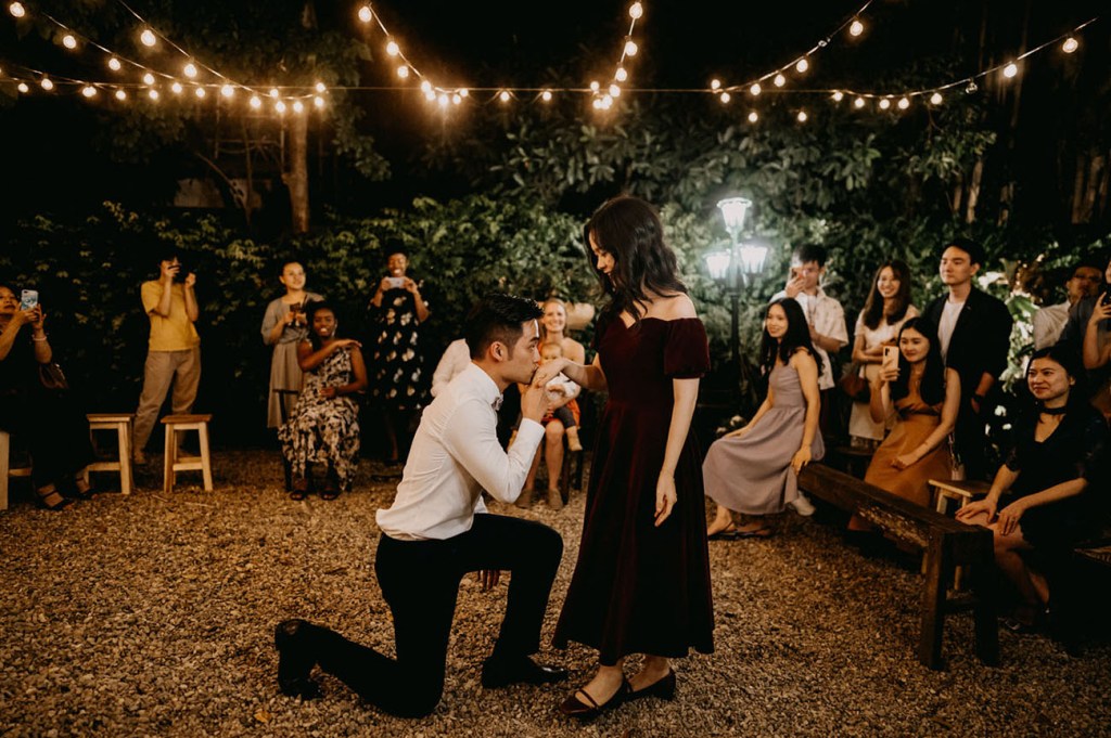 The bride changed for an off the shoulder burgundy velvet midi dress for the reception