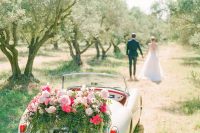 09 The getaway car was done with lush florals and greenery and looked amazing