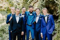 09 The groomsmen were rocking mismatching bold blue suits and peacock bow ties