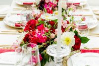 09 The tablescape was done with super lush and bright blooms and candles and bright napkins