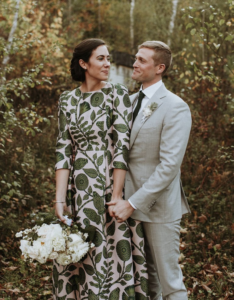 This fall wedding was done in green and white, with a cozy feel and a chic printed wedding dress