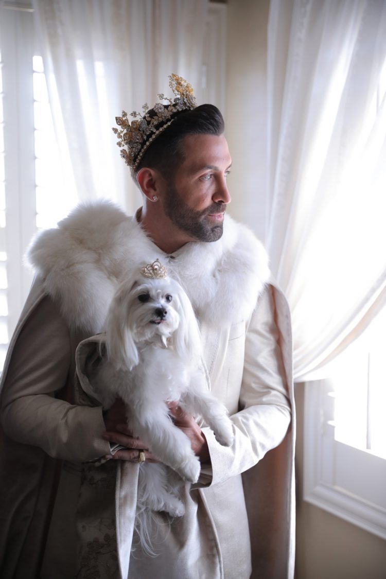 Both grooms were wearing white and gold, luxurious crowns and their dogs were dressed, too