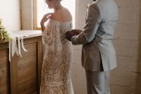 04 The bride was wearing an off the shoulder lace sheath wedding dress with a train, the groom was rocking a grey suit with a neutral tie