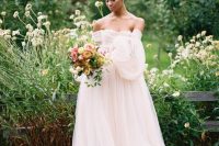 04 The second wedding dress was a refined flowy off the shoulder blush wedding gown