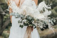 04 The wedding bouquet was done with white blooms, dried leaves, greenery and a nude ribbon