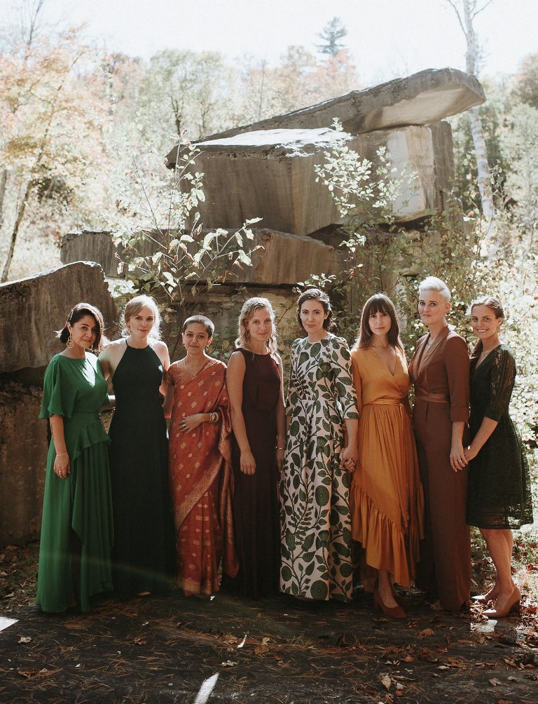 The bridesmaids were wearing mismatching fall-colored dresses