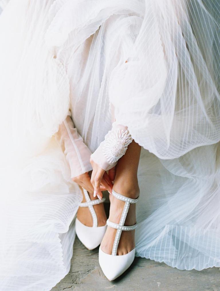 The wedding shoes were strappy and embellished and finished off the looks perfectly