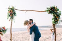 driftwood is a great material for a tropical inspired wedding arch