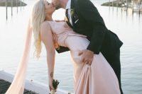06 a blush silk sheath wedding dress with a train and a blush veil for a romantic modern bridal look
