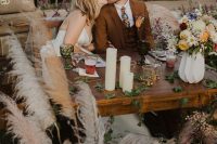 08 The sweetheart table was done with candles, pampas grass, blooms and greenery