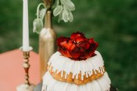 09 There was a large bundt wedding cake with glazing and a bloom on top