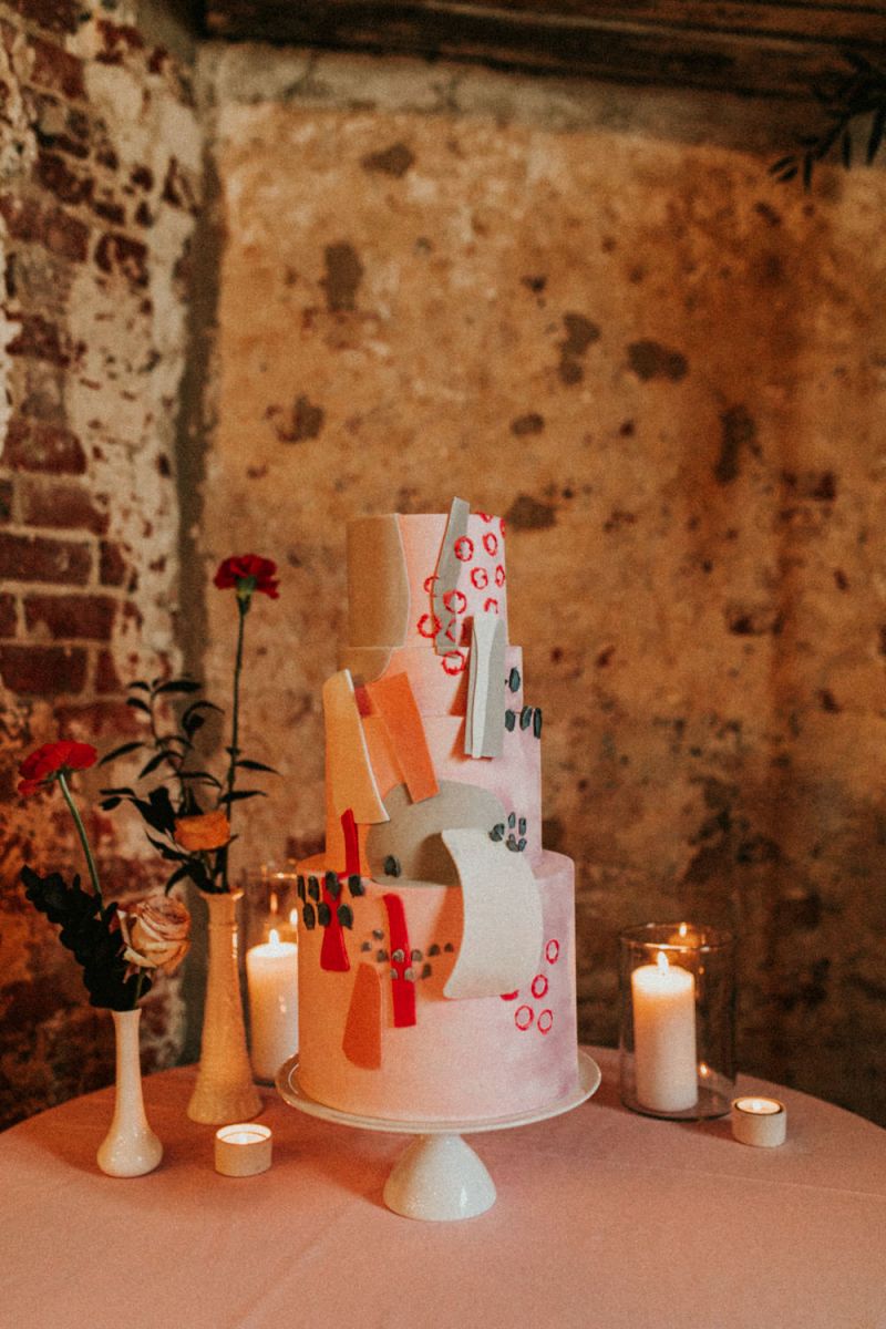 The second wedding cake in red, orange, pink, with white and grey chocolate shards
