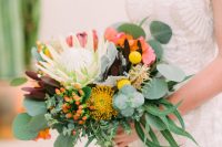10 The wedding bouquet featured bright blooms, greenery and various proteas