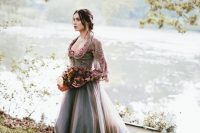 12 a purple grey A-line wedding dress with a floral embroidery bodice and long sleeves, a deep neckline and a train