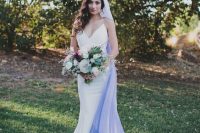 13 a modern plain mermaid wedding dress with spaghetti straps and an ombre white blue veil for a bold look