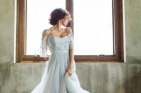14 a romantic and beautiful powder blue off the shoulder wedding dress with a layered skirt with a train is wow