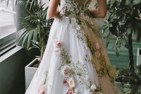 16 a fantastic one shoulder wedding dress in white with embroidery and floral appliques all over the dress