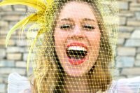 18 a retro wedding dress paired with a yellow birdcage veil with feathers for a bright and unusual touch