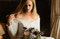 21 a plain off the shoulder wedding dress with long sleeves and a button row plus a lace veil for a modern fairy tale wedding